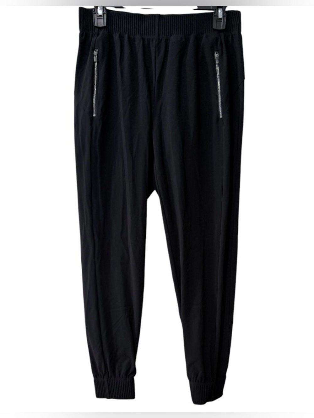 Athleta women’s Small black Cosmic Joggers with zippered front pockets.